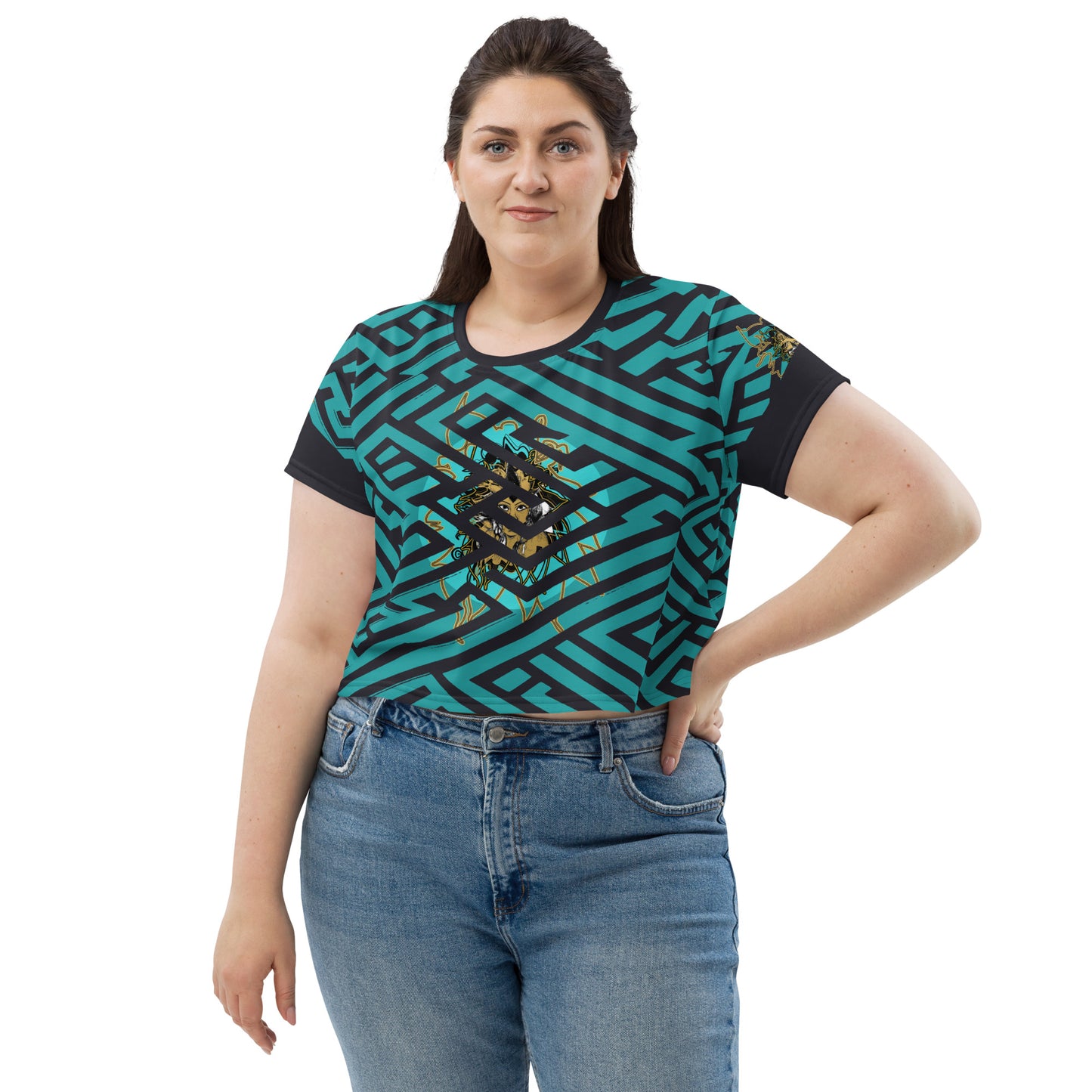 Front view of a vibrant blue and black geometric patterned crop top with a bold graphic centerpiece, worn by plus size model.