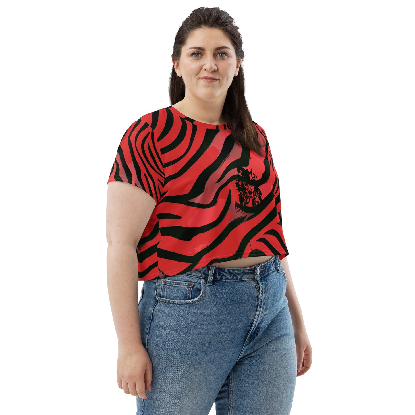 A model wearing bold red and black crop tee from Kloe Store featuring a striking artistic face design and abstract swirling patterns, showcasing trendy and edgy streetwear fashion."