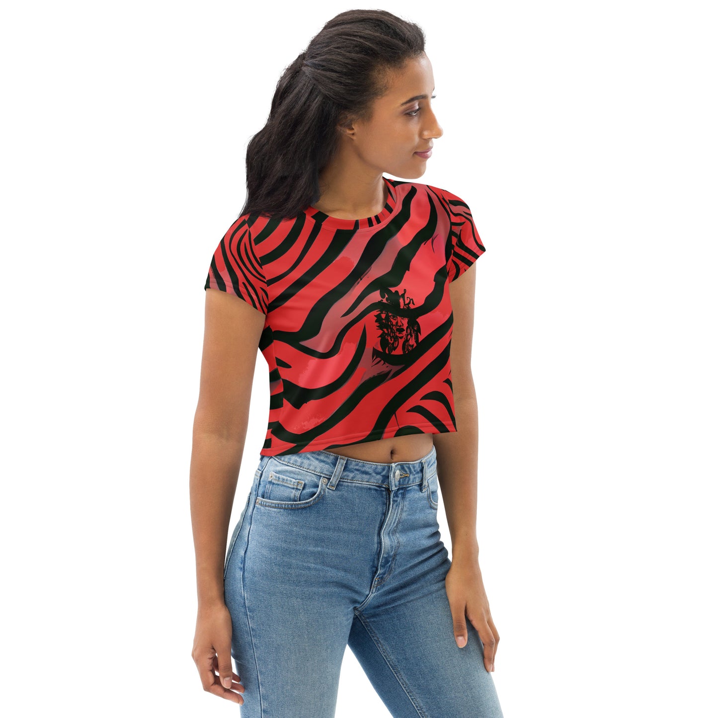 A model wearing bold red and black crop tee from Kloe Store featuring a striking artistic face design and abstract swirling patterns, showcasing trendy and edgy streetwear fashion.