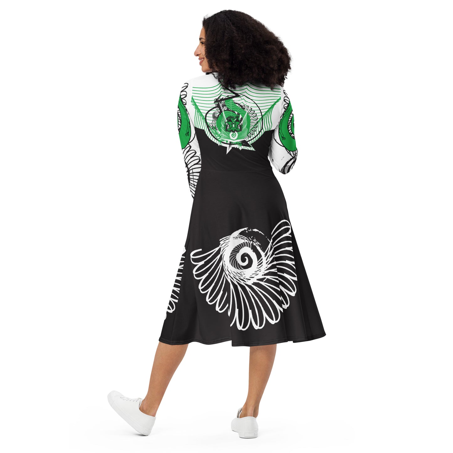 Hand-illustrated long-sleeve midi dress featuring bold green spirals, a drawing of two mirrored faces, and dynamic wing-inspired linework — designed for authentic self-expression and rooted in global artistic influence, exclusive to KLOE.