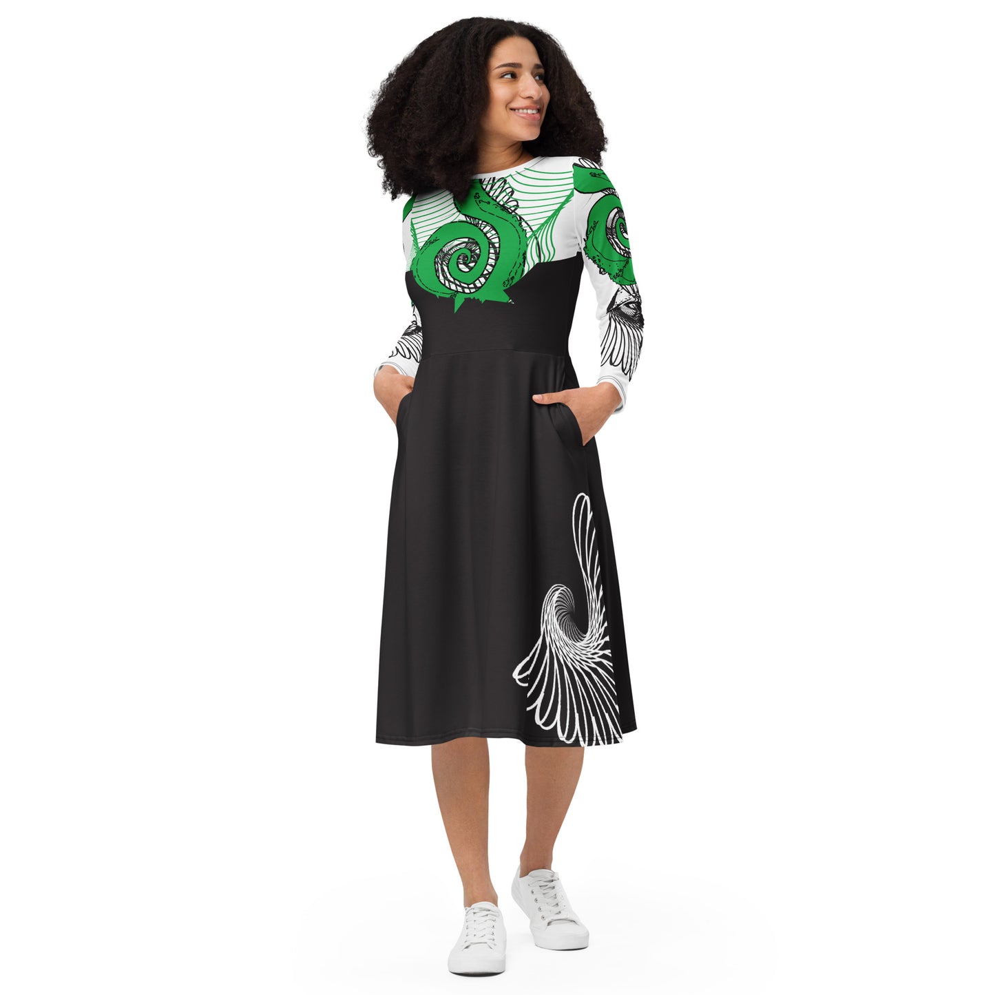 Hand-illustrated long-sleeve midi dress featuring bold green spirals, a drawing of two mirrored faces, and dynamic wing-inspired linework — designed for authentic self-expression and rooted in global artistic influence, exclusive to KLOE.