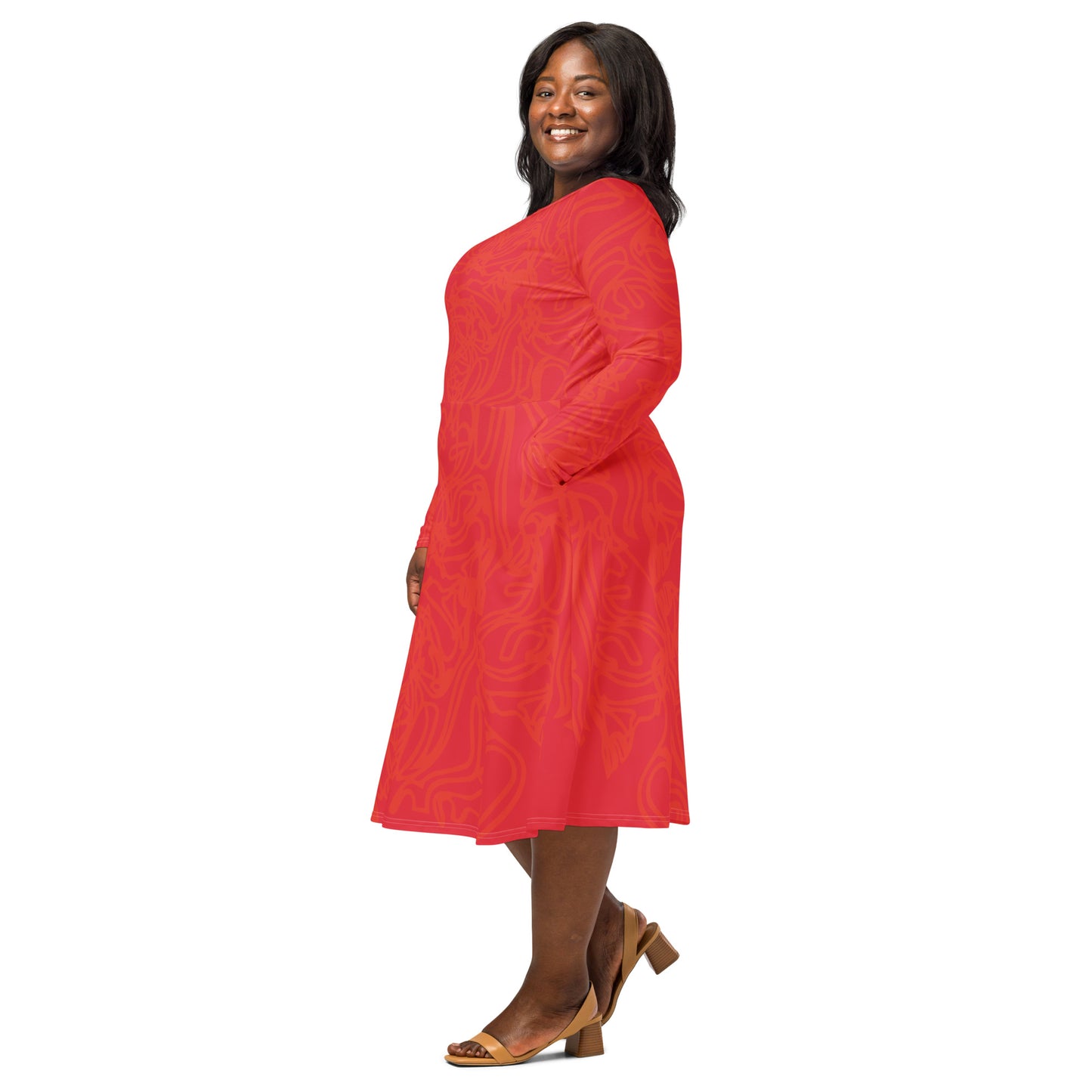 Red dress with vibrant swirl details and mirrored face design on the back, inspired by cultural art and bold self-expression.