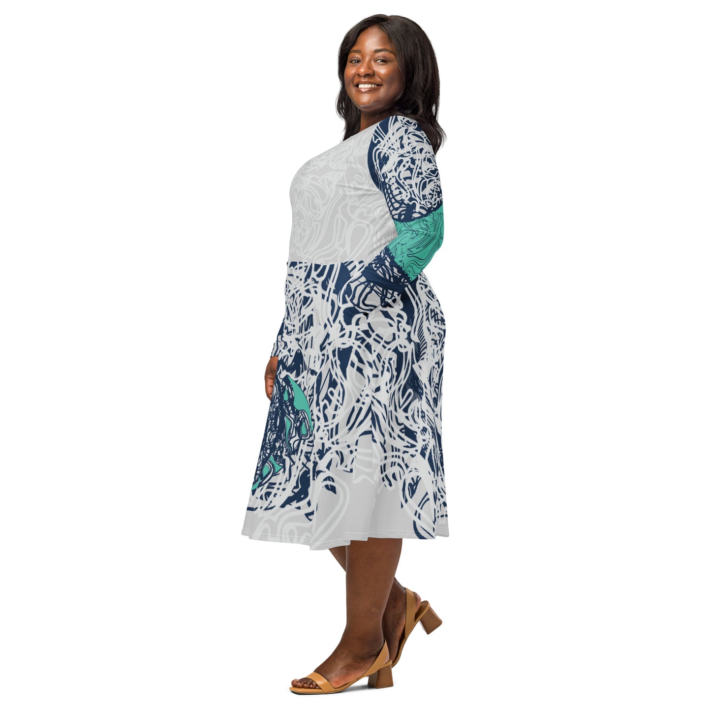 Long sleeve midi dress with full-body abstract print in navy and jade, featuring hand-drawn mirrored faces and layered spiral motifs—designed to express standout individuality.