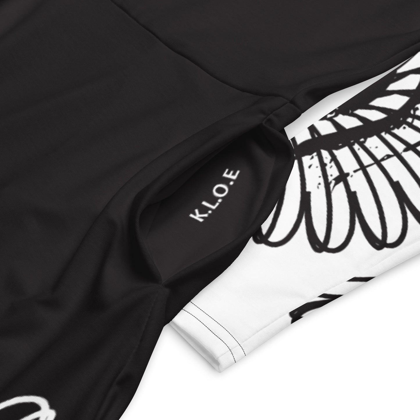 Hand-illustrated long-sleeve midi dress featuring bold green spirals, a drawing of two mirrored faces, and dynamic wing-inspired linework — designed for authentic self-expression and rooted in global artistic influence, exclusive to KLOE.