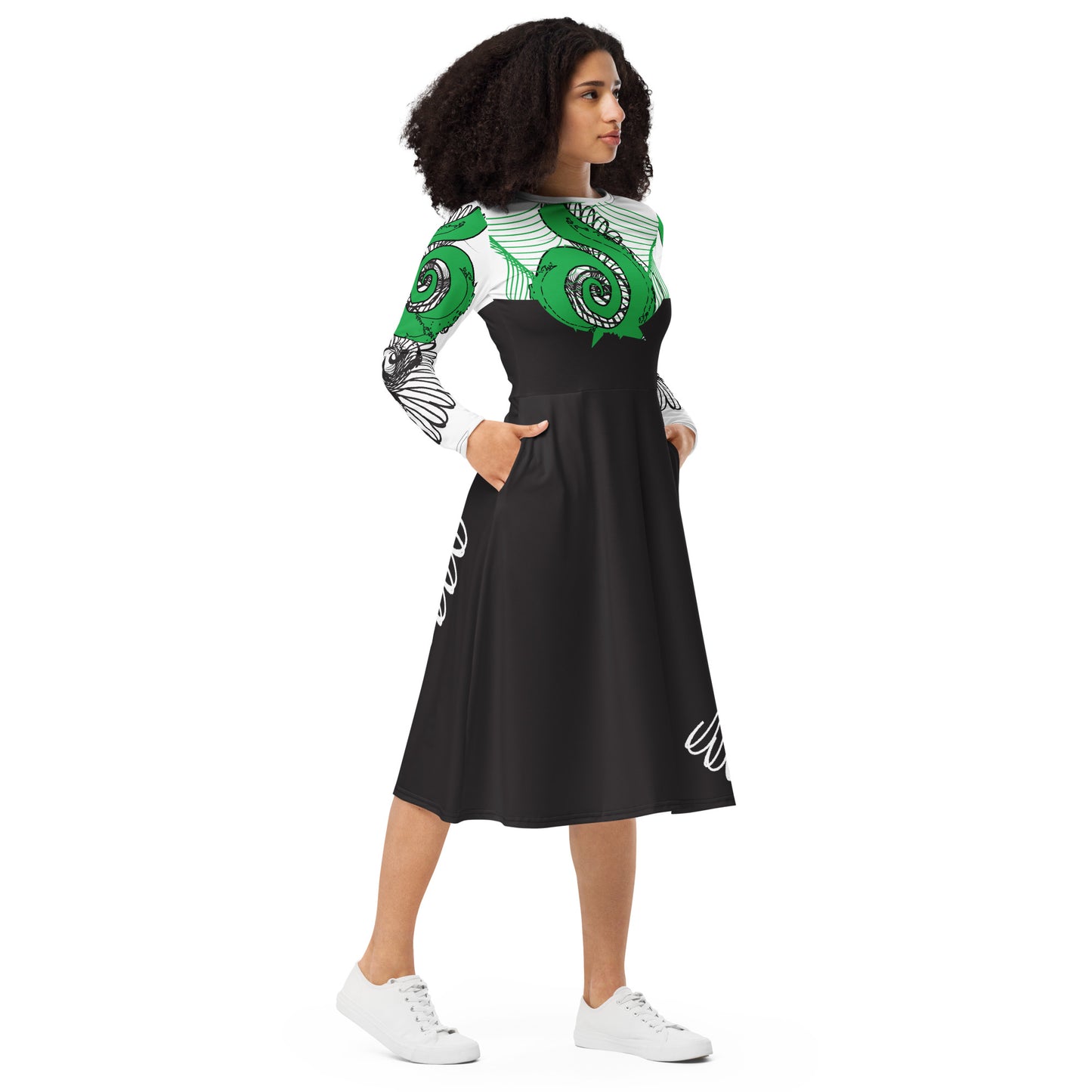 Hand-illustrated long-sleeve midi dress featuring bold green spirals, a drawing of two mirrored faces, and dynamic wing-inspired linework — designed for authentic self-expression and rooted in global artistic influence, exclusive to KLOE.