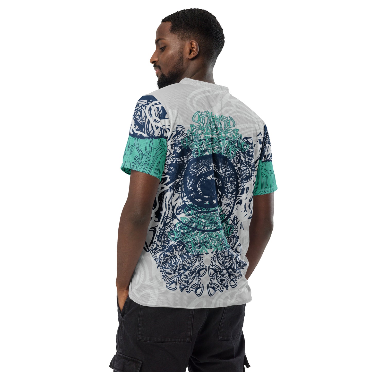 All-over print recycled unisex sports jersey featuring hand-drawn, culturally inspired artwork in navy and jade tones—celebrating individuality and artistic expression through intricate, abstract symbolism. Made by KLOE.