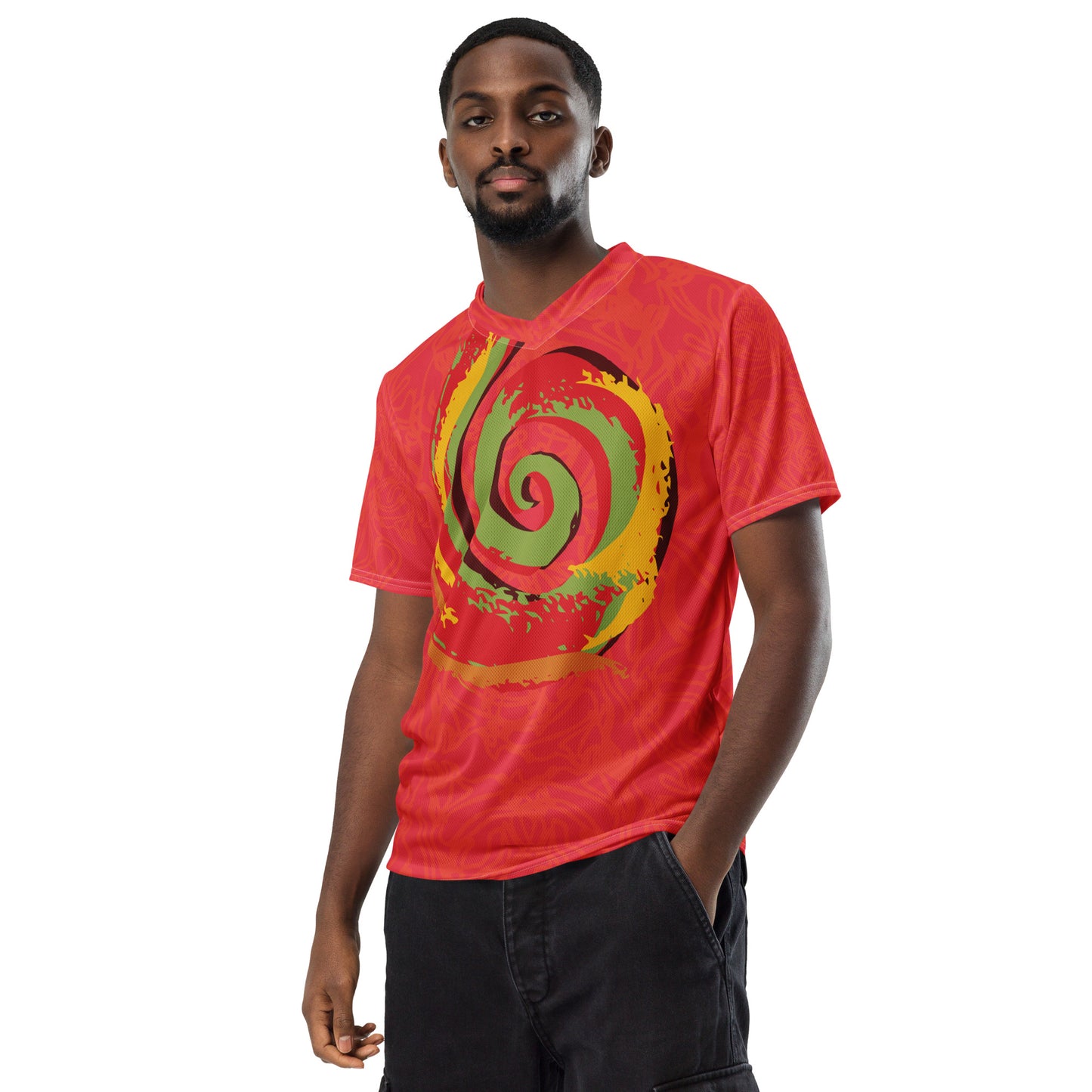 Red sports jersey with bold swirl on the front and mirrored face design on the back, inspired by cultural art and self-expression.