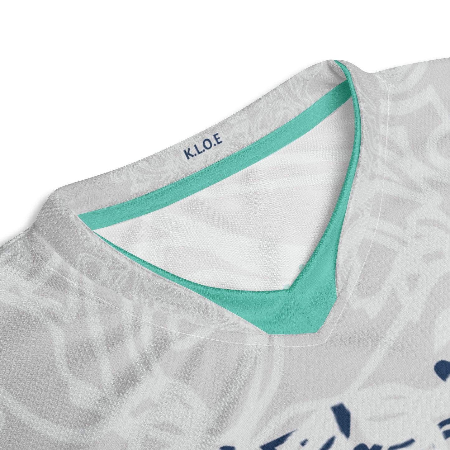 All-over print recycled unisex sports jersey featuring hand-drawn, culturally inspired artwork in navy and jade tones—celebrating individuality and artistic expression through intricate, abstract symbolism. Made by KLOE.