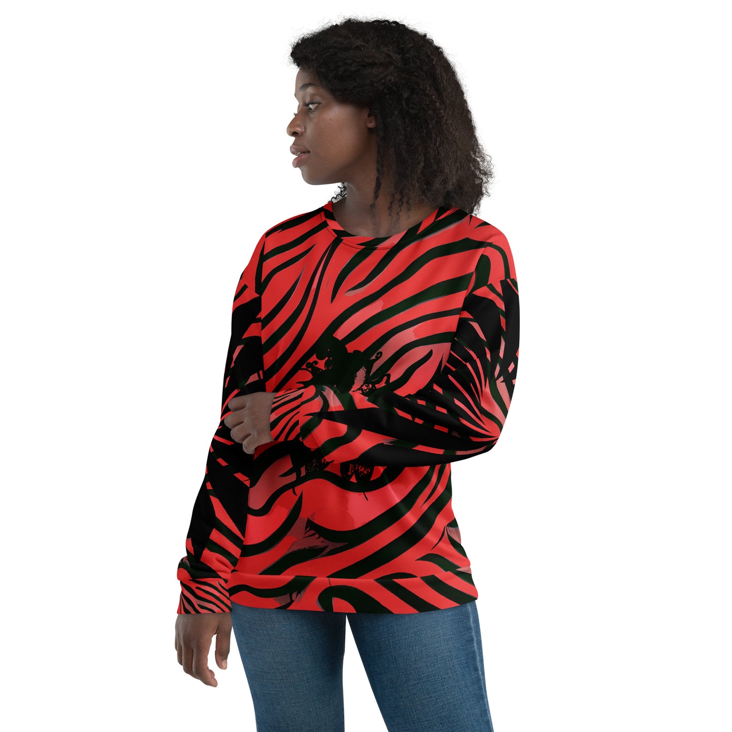 Front view of a model wearing a bold red and black unisex sweatshirt from Kloe Store featuring a striking artistic face design, showcasing unique streetwear style with a vibrant, swirling pattern.