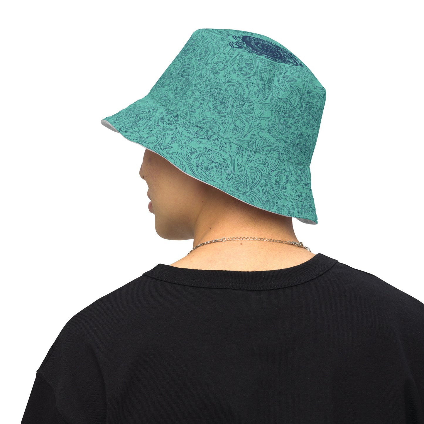 Reversible bucket hat with abstract jade and white linework, featuring dual-face artwork on one side and K.L.O.E logo on the other—crafted for bold, expressive style.