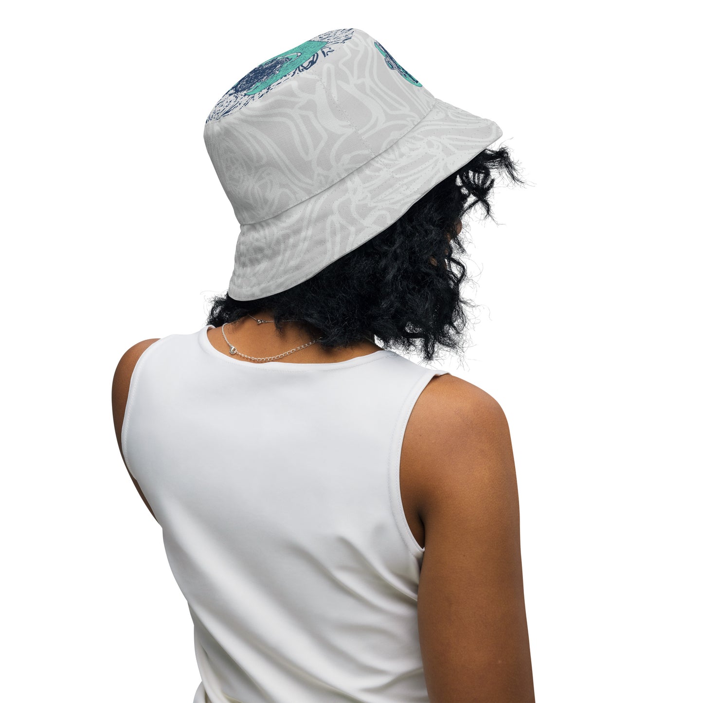 Reversible bucket hat with abstract jade and white linework, featuring dual-face artwork on one side and K.L.O.E logo on the other—crafted for bold, expressive style.