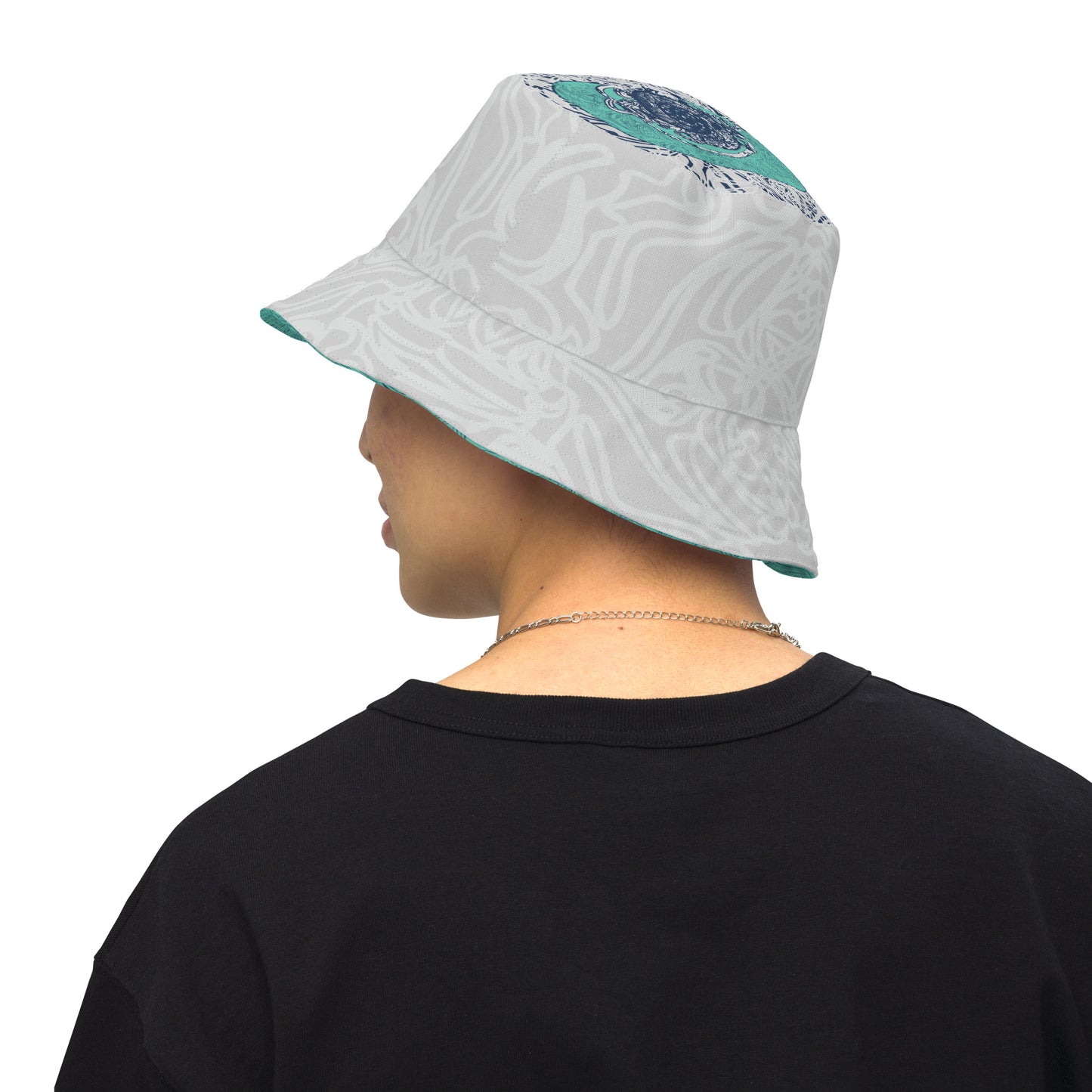 Reversible bucket hat with abstract jade and white linework, featuring dual-face artwork on one side and K.L.O.E logo on the other—crafted for bold, expressive style.