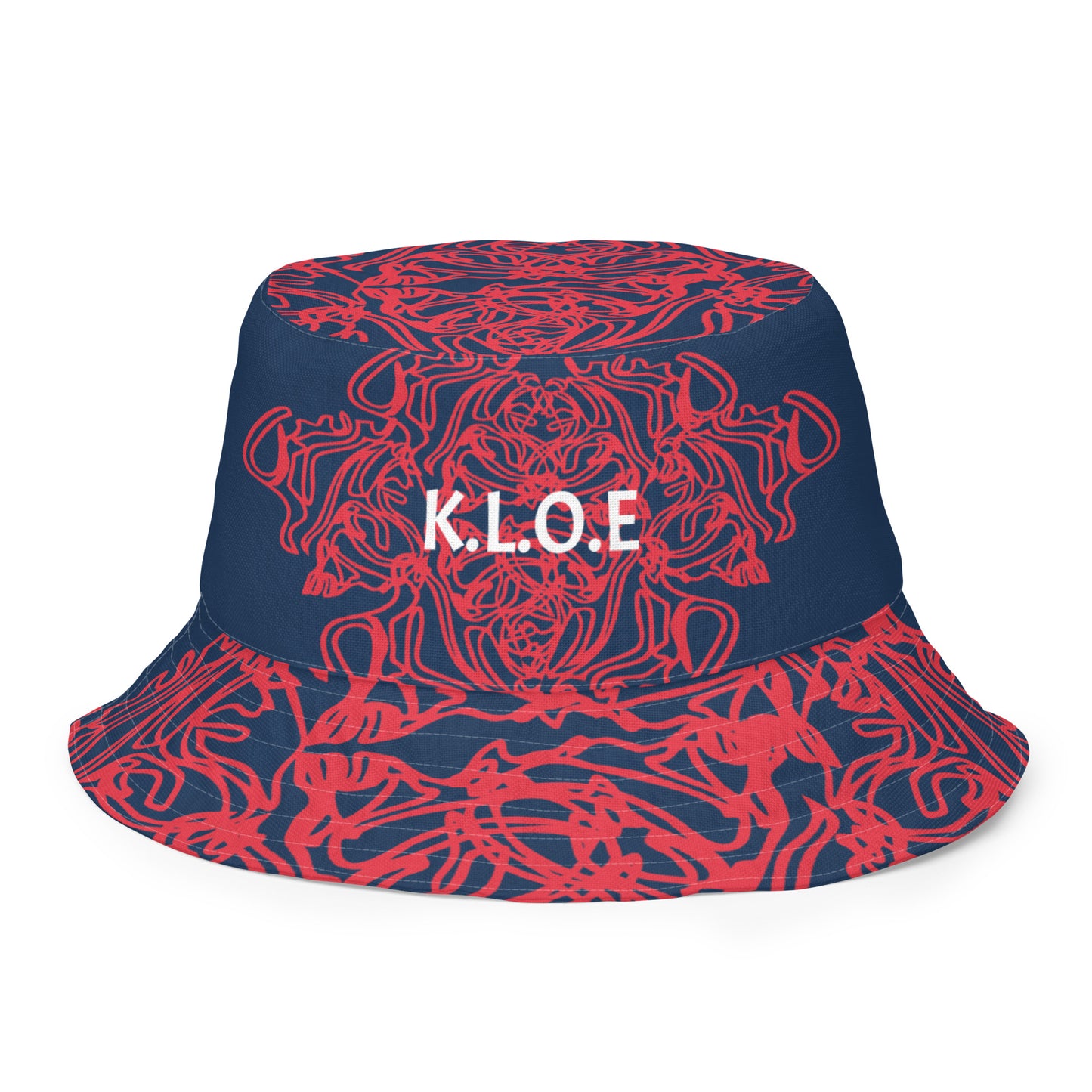 Bold reversible streetwear bucket hat featuring hand-drawn tribal patterns on one side and a mirrored face design on the other, crafted in navy and red for an edgy, modern look – KLOE fashion.