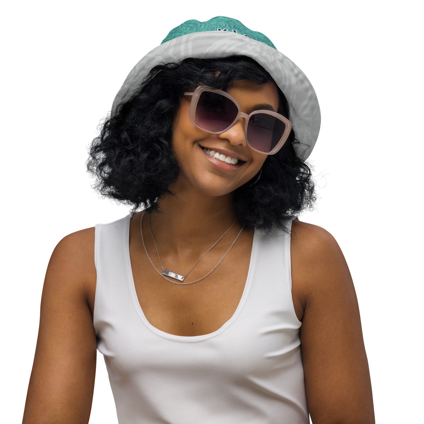 Reversible bucket hat with abstract jade and white linework, featuring dual-face artwork on one side and K.L.O.E logo on the other—crafted for bold, expressive style.