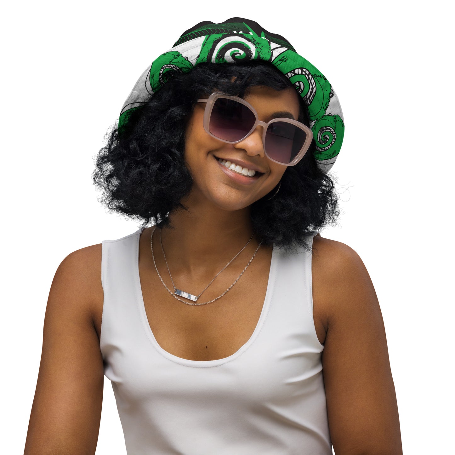 Hand-illustrated reversible bucket hat featuring bold green spirals and intricate web-inspired patterns — crafted for versatile self-expression and rooted in artistic individuality, exclusive to KLOE.