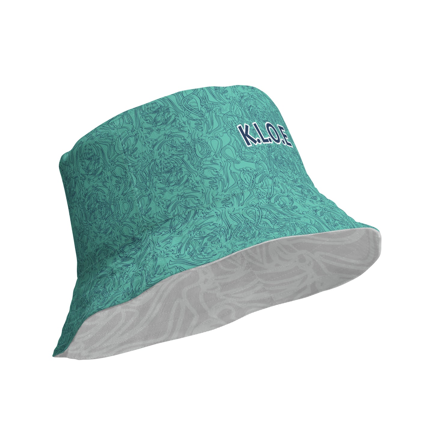 Reversible bucket hat with abstract jade and white linework, featuring dual-face artwork on one side and K.L.O.E logo on the other—crafted for bold, expressive style.