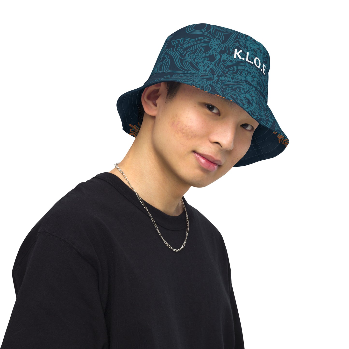 Navy blue bucket hat with cyan line art and 'K.L.O.E' branding on the front, offering a minimal yet artistic aesthetic, worn by a model.