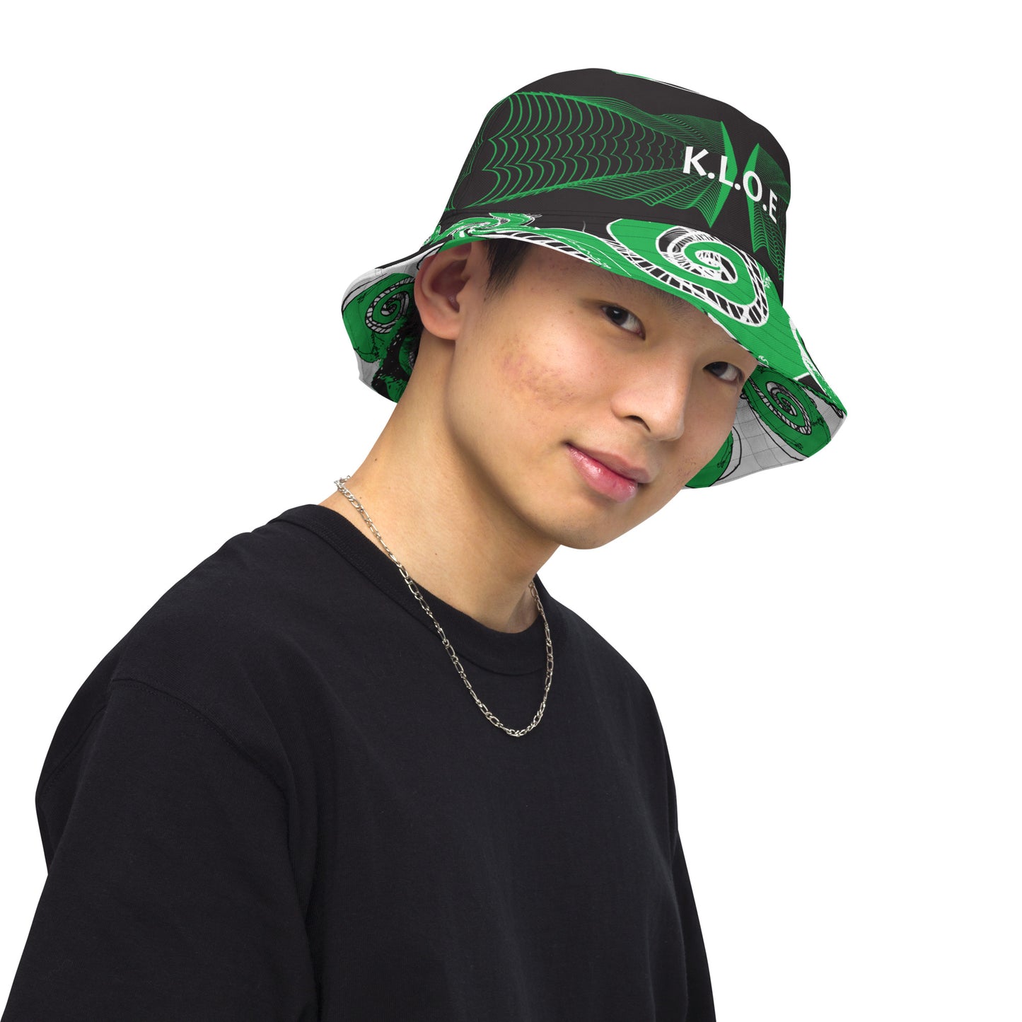 Hand-illustrated reversible bucket hat featuring bold green spirals and intricate web-inspired patterns — crafted for versatile self-expression and rooted in artistic individuality, exclusive to KLOE.
