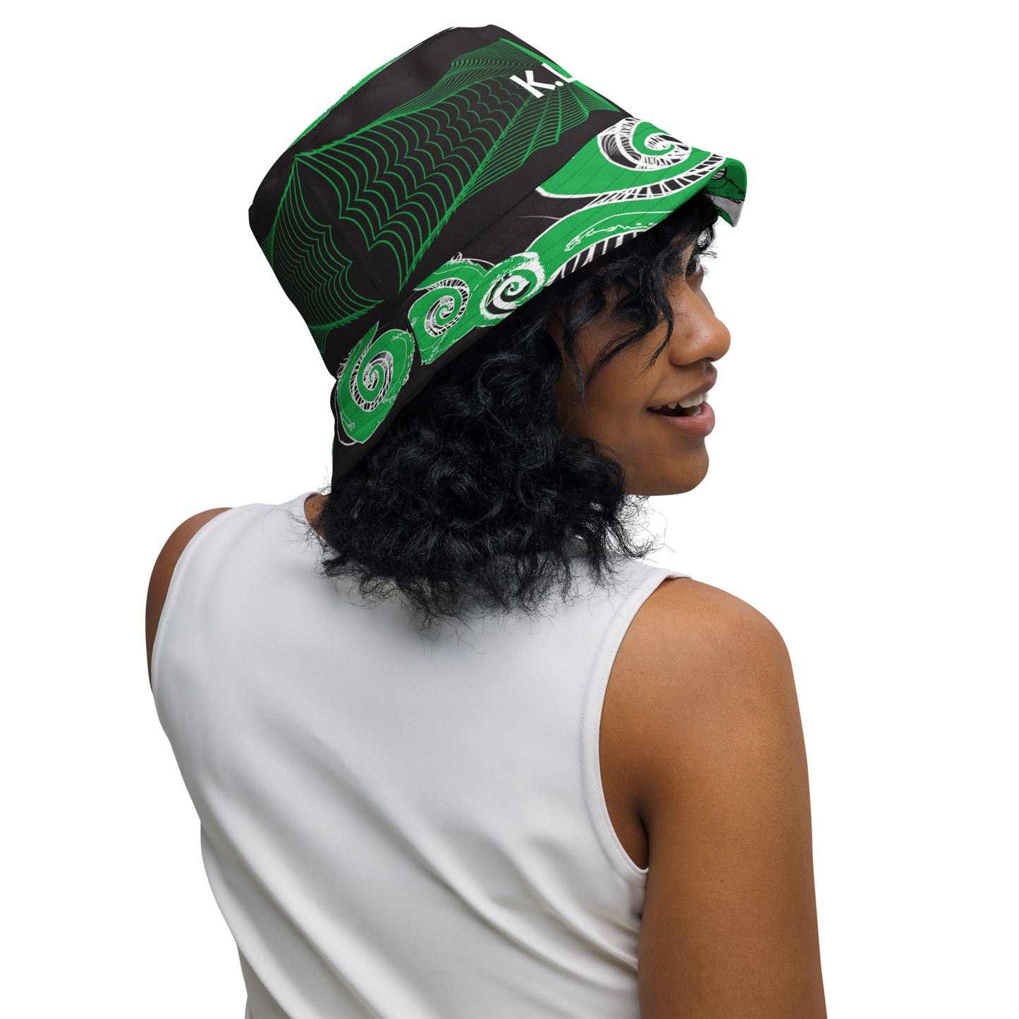 Hand-illustrated reversible bucket hat featuring bold green spirals and intricate web-inspired patterns — crafted for versatile self-expression and rooted in artistic individuality, exclusive to KLOE.
