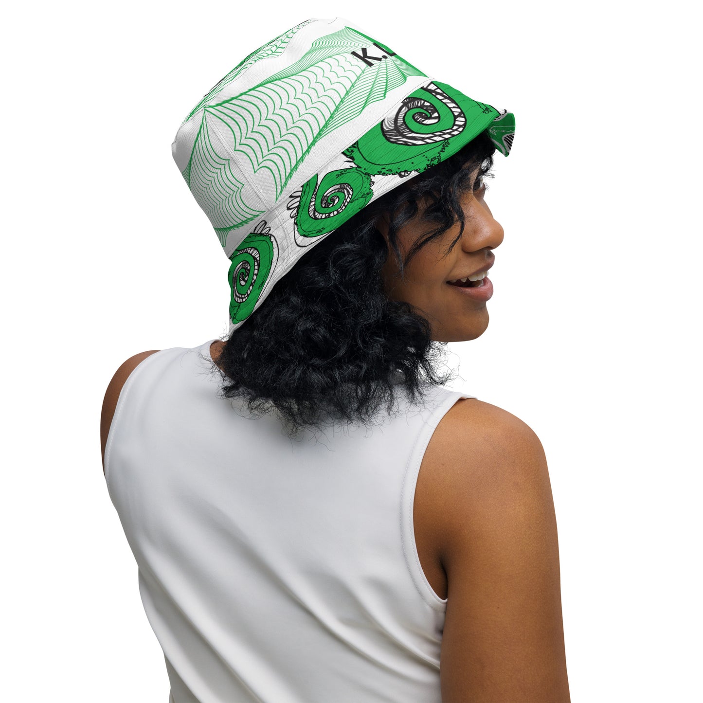 Hand-illustrated reversible bucket hat featuring bold green spirals and intricate web-inspired patterns — crafted for versatile self-expression and rooted in artistic individuality, exclusive to KLOE.