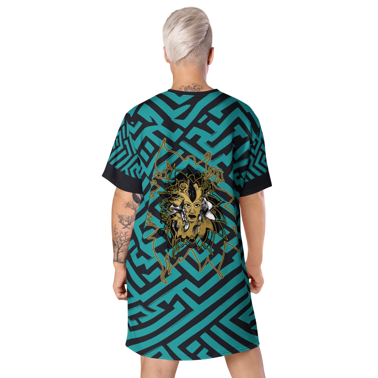 Back view of KLOE Store bohemian style dress featuring bold green and black geometric patterns with an intricate golden artistic face design, highlighting expressive and modern boho fashion, on a model.