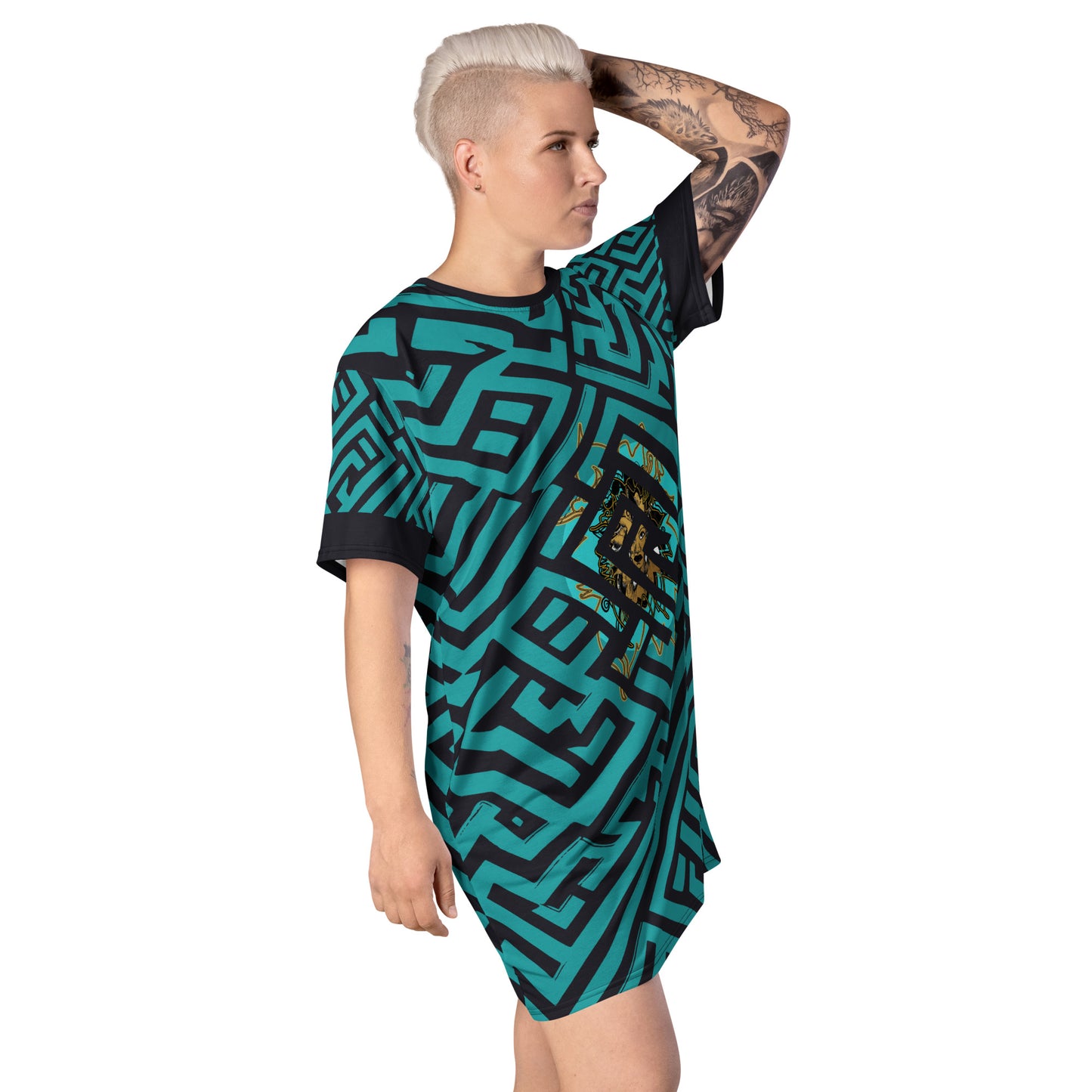 Side view of a model wearing KLOE bohemian style dress featuring bold green and black geometric patterns with a central golden artistic face design, showcasing expressive and modern boho style fashion.