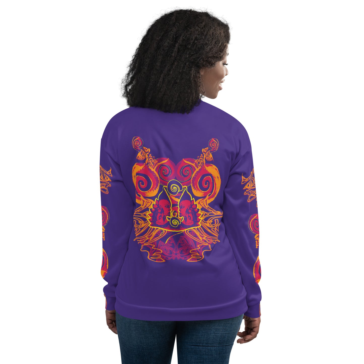 Back view of a bold purple bomber jacket with vibrant orange and red culturally inspired patterns, featuring mirrored face design and swirling motifs — expressive fashion from KLOE’s The Secret Chambers of I & I collection, on a model.