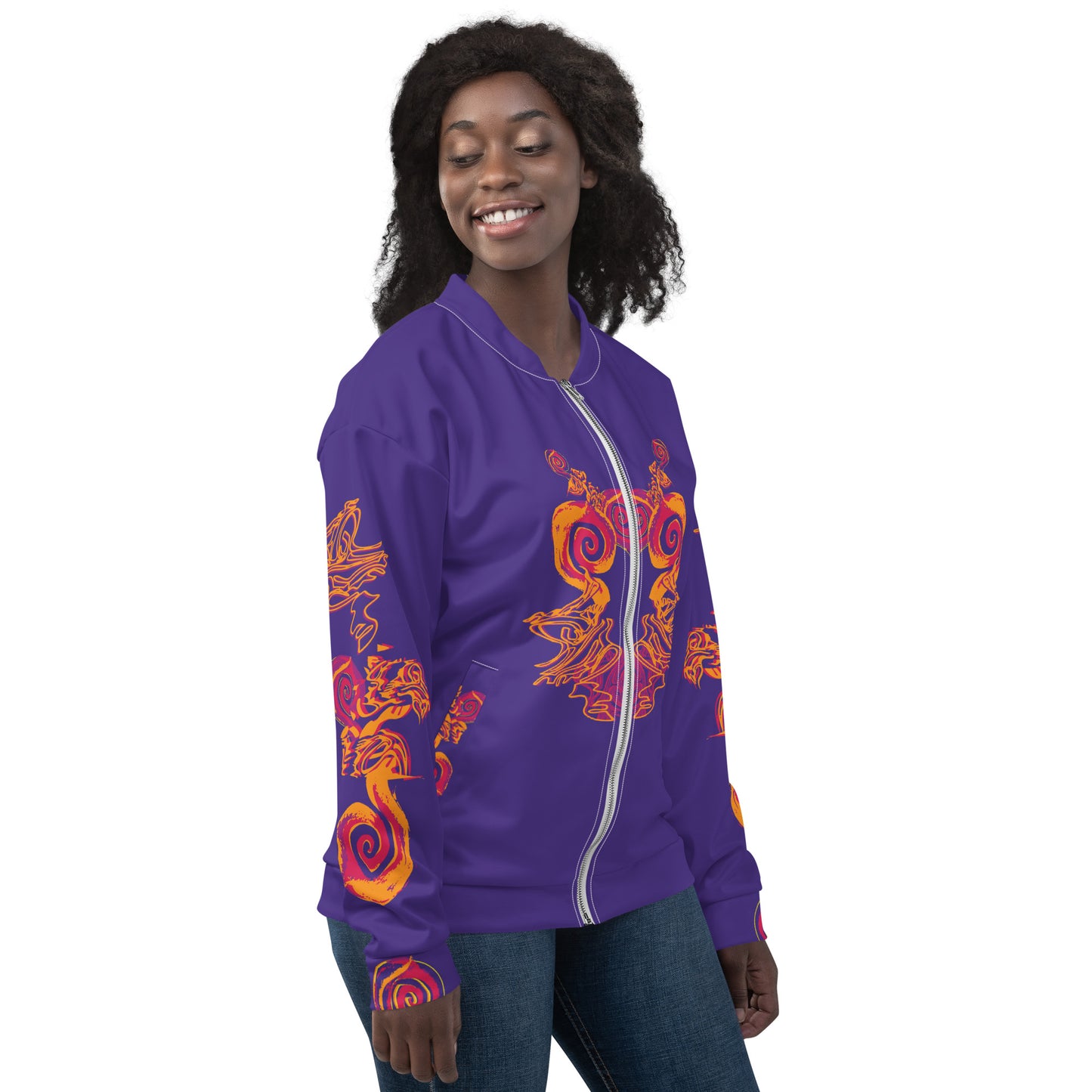 Bold purple bomber jacket with vibrant orange and red culturally inspired patterns, featuring mirrored face design and swirling motifs — expressive fashion from KLOE’s The Secret Chambers of I & I collection, on a model.