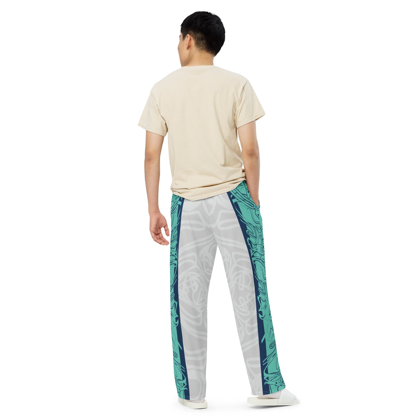 Unisex wide-leg pants with jade and navy abstract print, featuring dynamic spiral patterns and hand-drawn linework for a bold, artistic look.