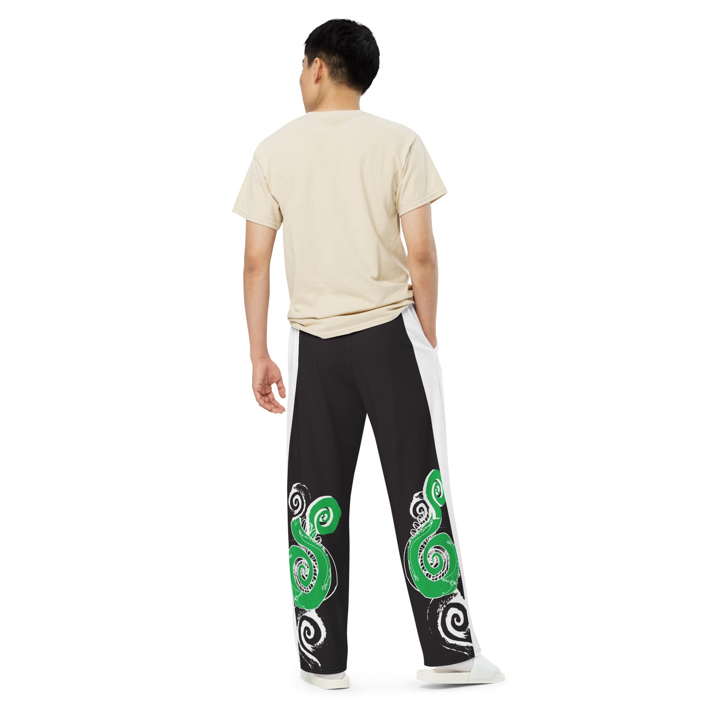 Hand-illustrated unisex wide-leg pants featuring bold green spirals and expressive linework — crafted for standout comfort, movement, and authentic self-expression, exclusive to KLOE.