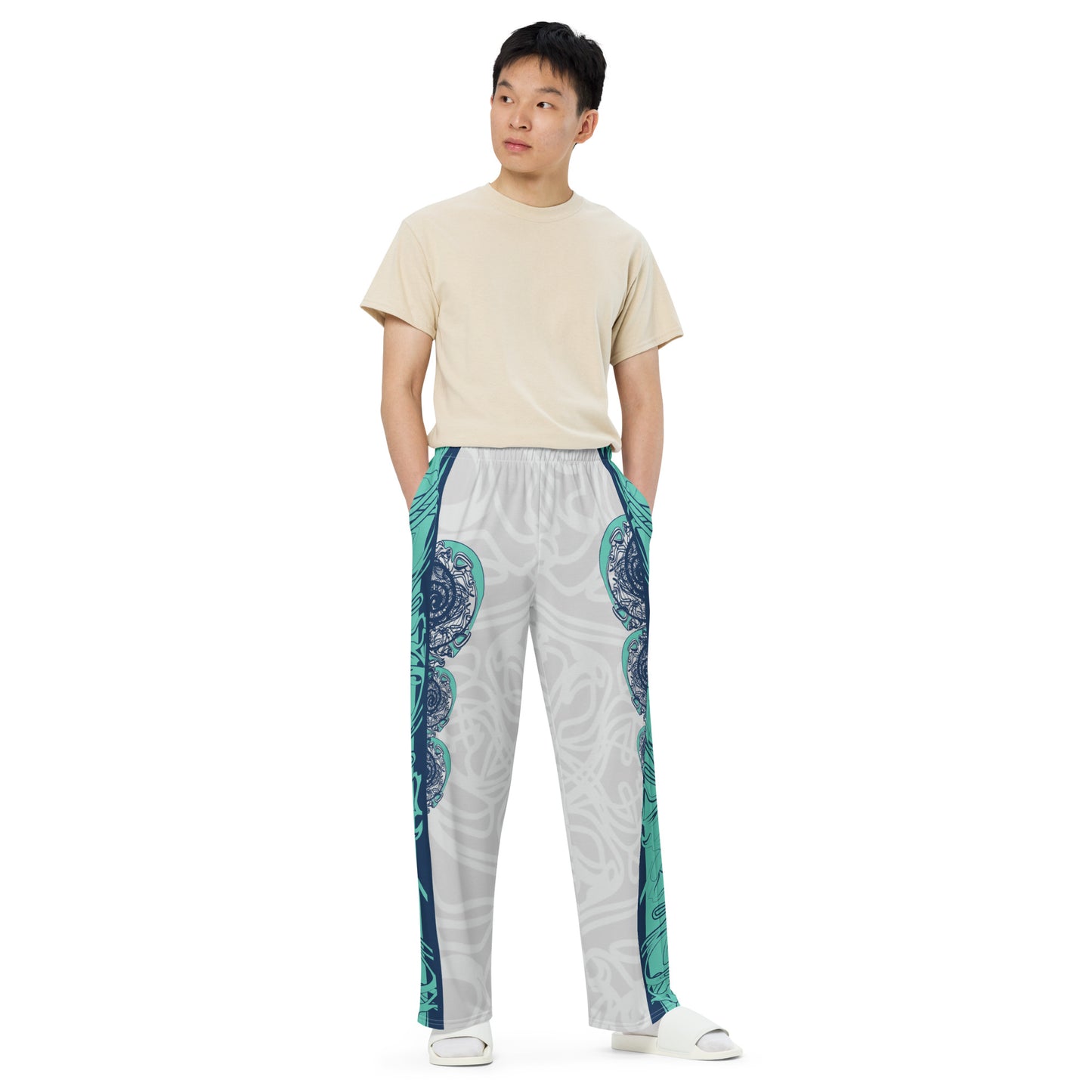 Unisex wide-leg pants with jade and navy abstract print, featuring dynamic spiral patterns and hand-drawn linework for a bold, artistic look.