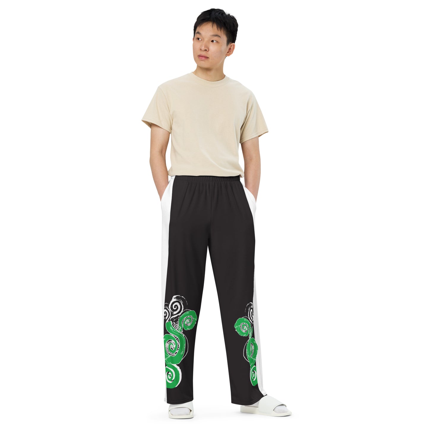 Hand-illustrated unisex wide-leg pants featuring bold green spirals and expressive linework — crafted for standout comfort, movement, and authentic self-expression, exclusive to KLOE.