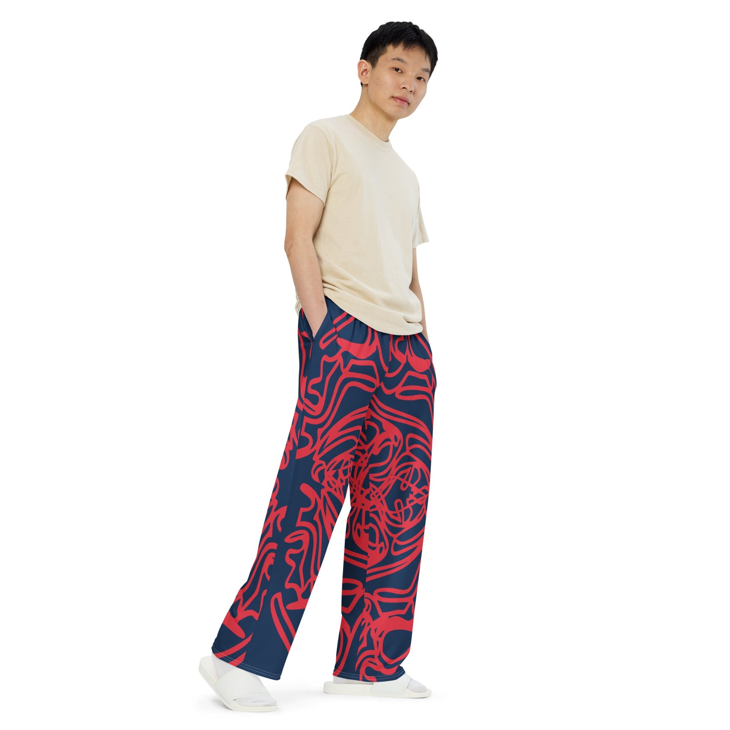 Bold navy and red streetwear pants featuring hand-drawn tribal patterns, culturally inspired and designed for a modern, relaxed fit with an edgy, artistic style – KLOE fashion.