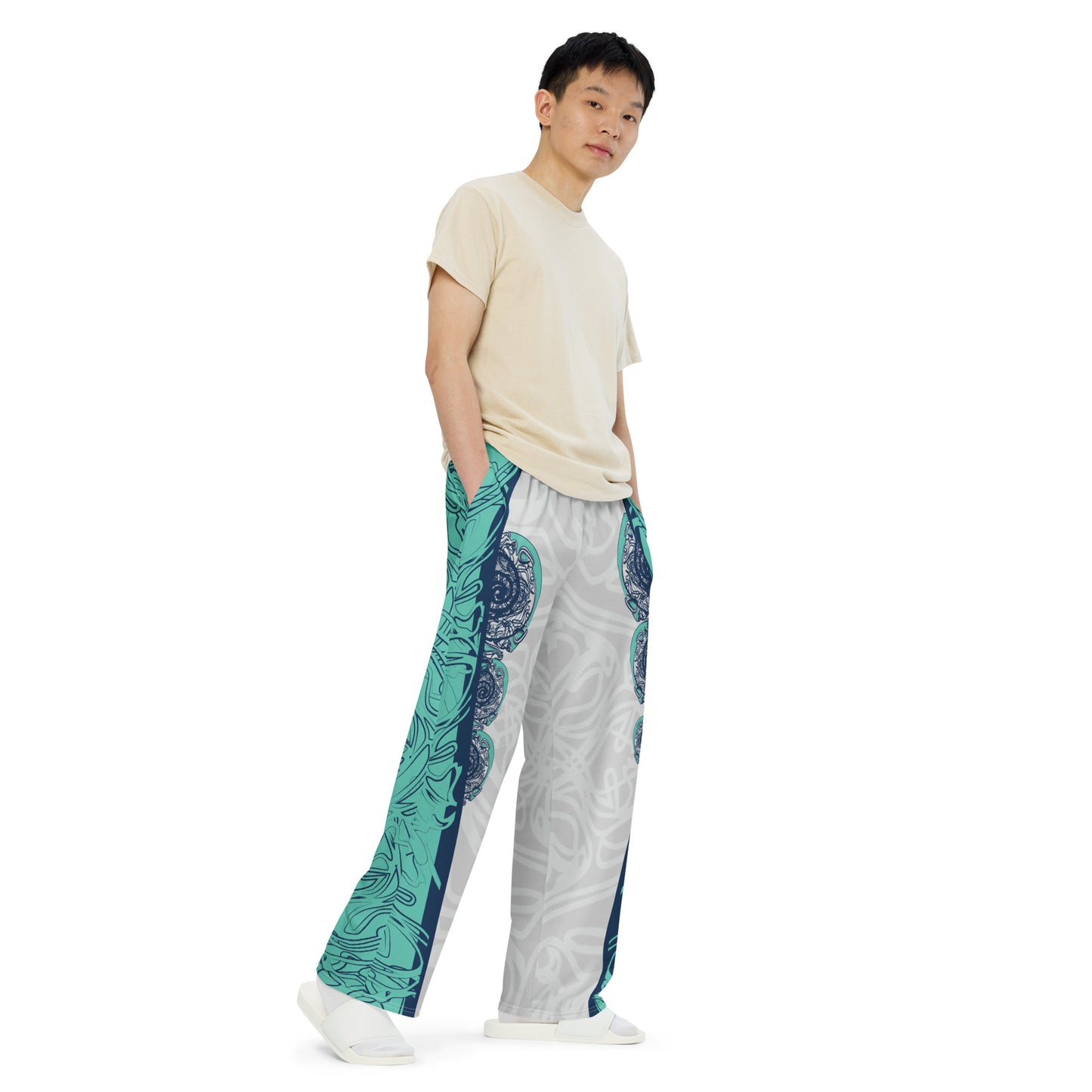 Unisex wide-leg pants with jade and navy abstract print, featuring dynamic spiral patterns and hand-drawn linework for a bold, artistic look.