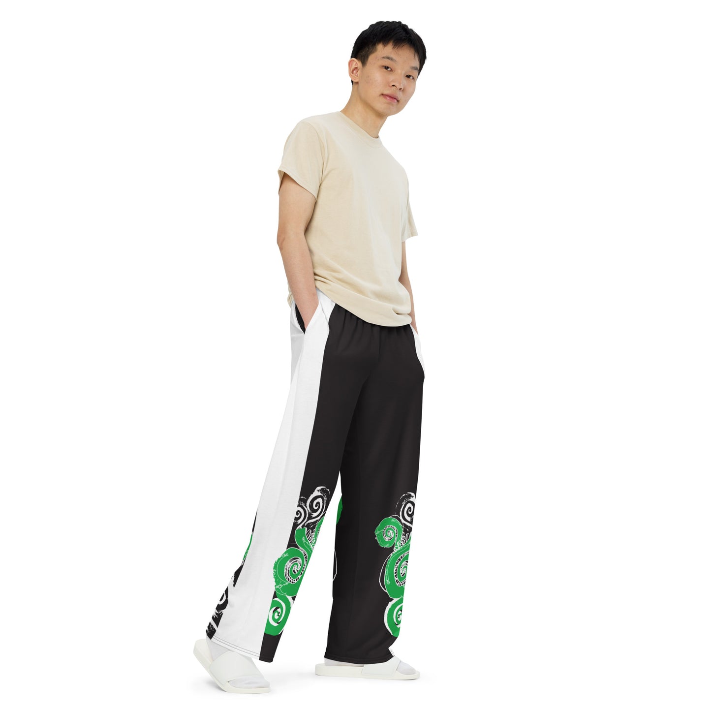 Hand-illustrated unisex wide-leg pants featuring bold green spirals and expressive linework — crafted for standout comfort, movement, and authentic self-expression, exclusive to KLOE.