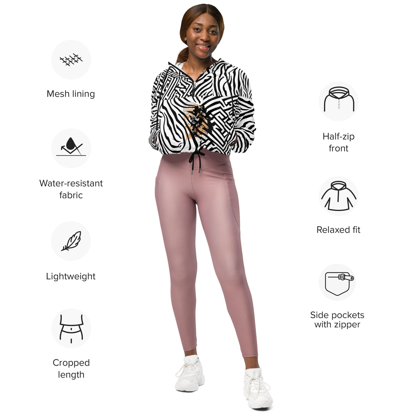 The model wearing black and white zebra print cropped windbreaker from Kloe Store featuring bold geometric patterns and an artistic face design, perfect for trendy streetwear fashion with an edgy, modern look, showing the product specifications.
