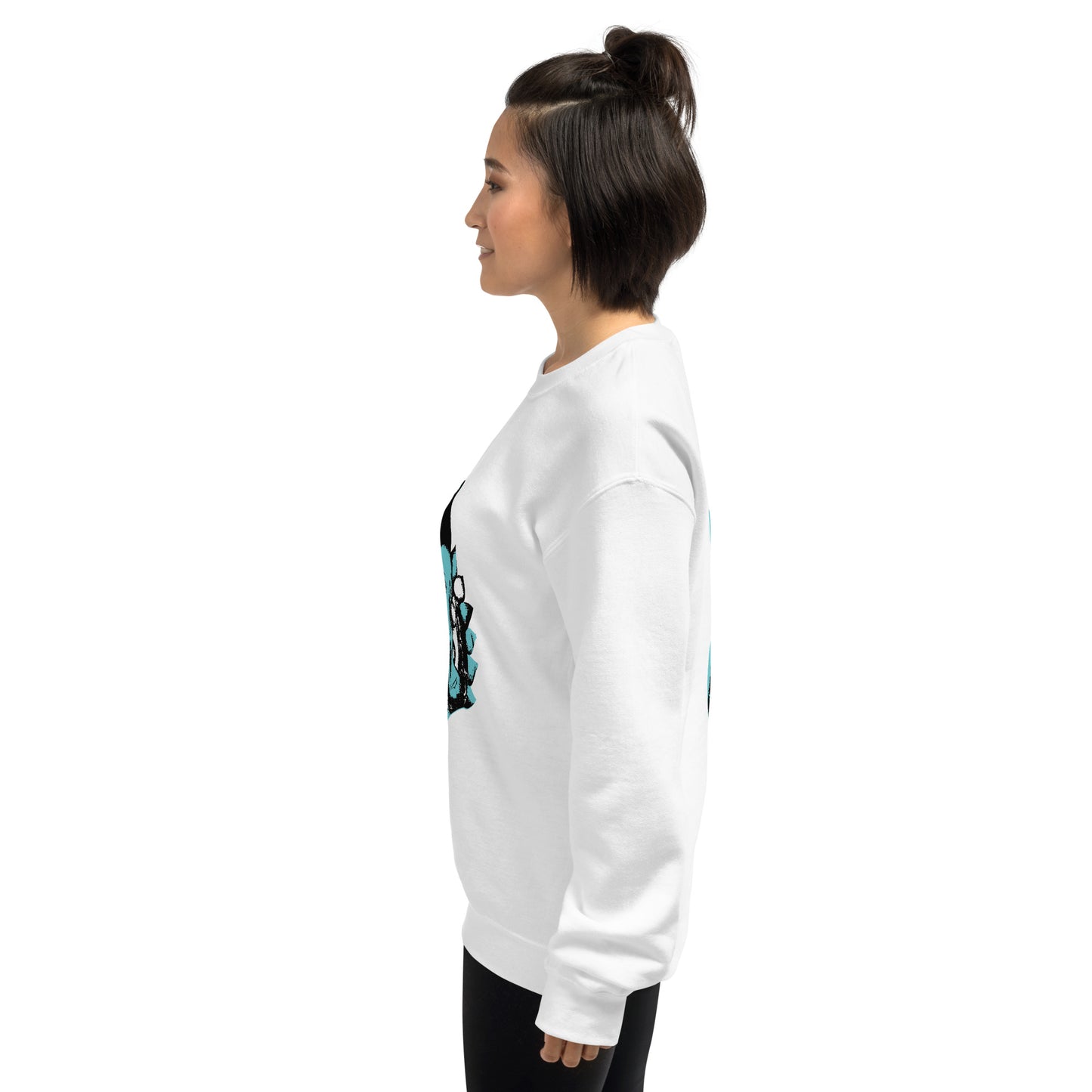 A model wearing the white K.L.O.E. sweatshirt featuring a hand-drawn design of two mirrored faces in bold black and teal, showcasing cultural inspiration, individuality, and modern bohemian style self-expression.