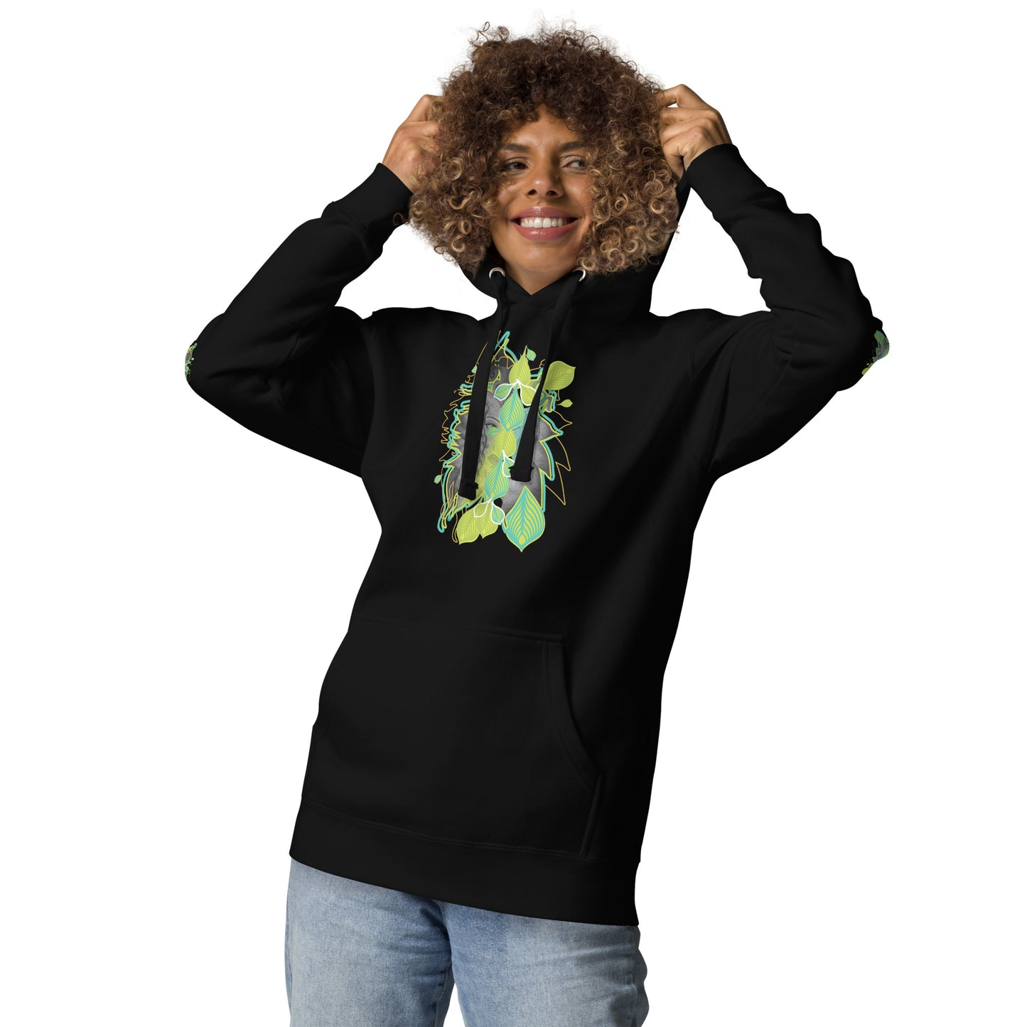 Front view of black K.L.O.E. hoodie with vibrant green and yellow leaf patterns framing a detailed hand-drawn face design. A modern bohemian style statement that celebrates individuality, artistic expression, and culturally inspired fashion, on a model.