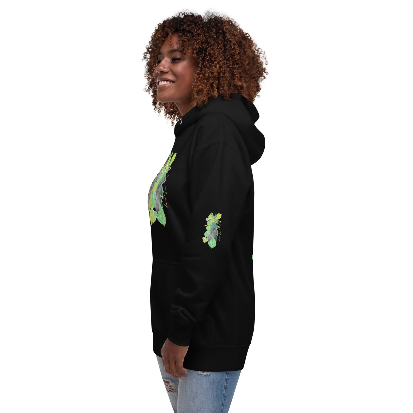 Side view of black K.L.O.E. hoodie with vibrant green and yellow leaf patterns framing a detailed hand-drawn face design. A modern bohemian style statement that celebrates individuality, artistic expression, and culturally inspired fashion.