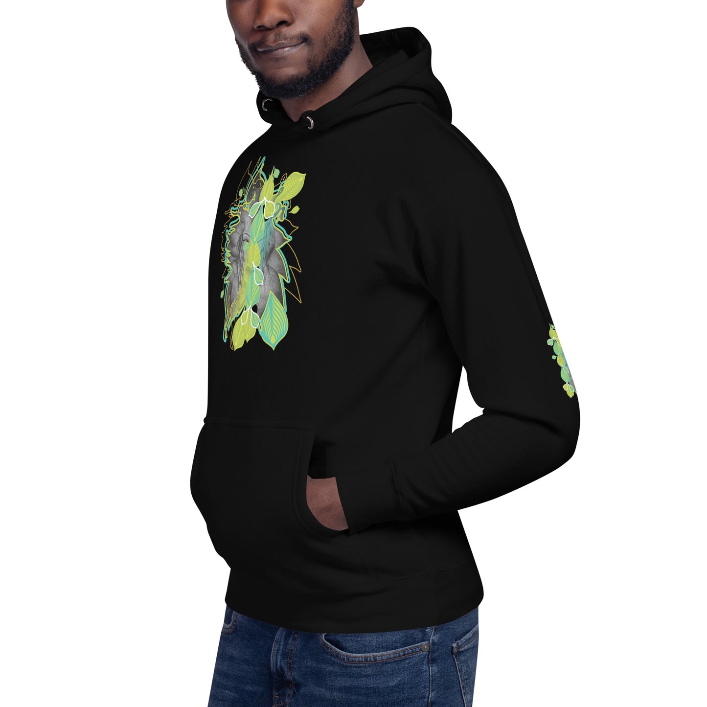 Front view of black K.L.O.E. hoodie with vibrant green and yellow leaf patterns framing a detailed hand-drawn face design. A modern bohemian style statement that celebrates individuality, artistic expression, and culturally inspired fashion, on a model.