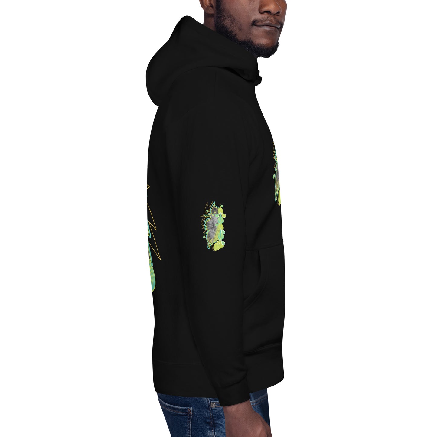Side view of black K.L.O.E. hoodie with vibrant green and yellow leaf patterns framing a detailed hand-drawn face design. A modern bohemian style statement that celebrates individuality, artistic expression, and culturally inspired fashion, on a model.