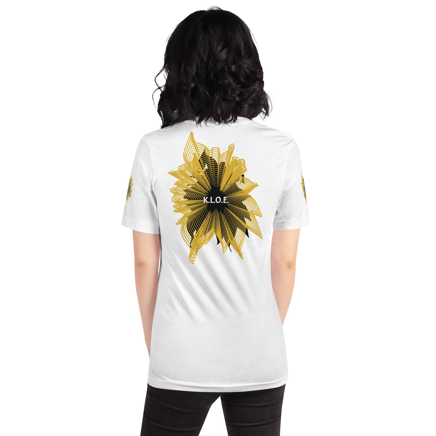 Back view of a white K.L.O.E. T-shirt showcasing a bold hand-drawn golden abstract sunburst design with black accents and the K.L.O.E. logo—an artistic and empowering piece of culturally inspired, handcrafted fashion that blends modern boho style with expressive apparel, celebrating individuality and self-expression, on a model.