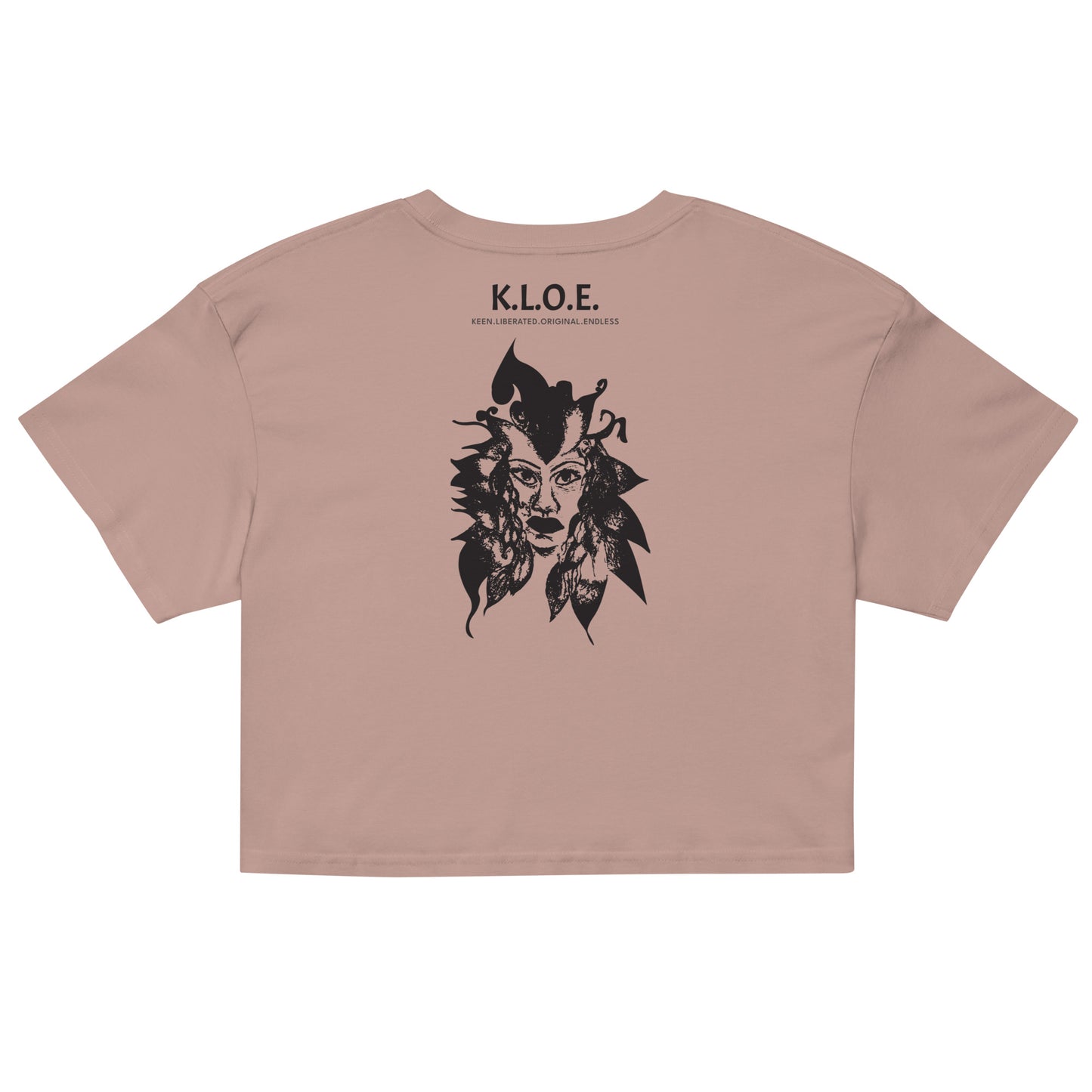 Back view of a hazy pink K.L.O.E. crop t-shirt showcasing a culturally inspired, hand-drawn black design featuring a bold, expressive face intertwined with flowing, abstract patterns, and K.L.O.E. logo, embodying artistic self-expression and modern bohemian style fashion.