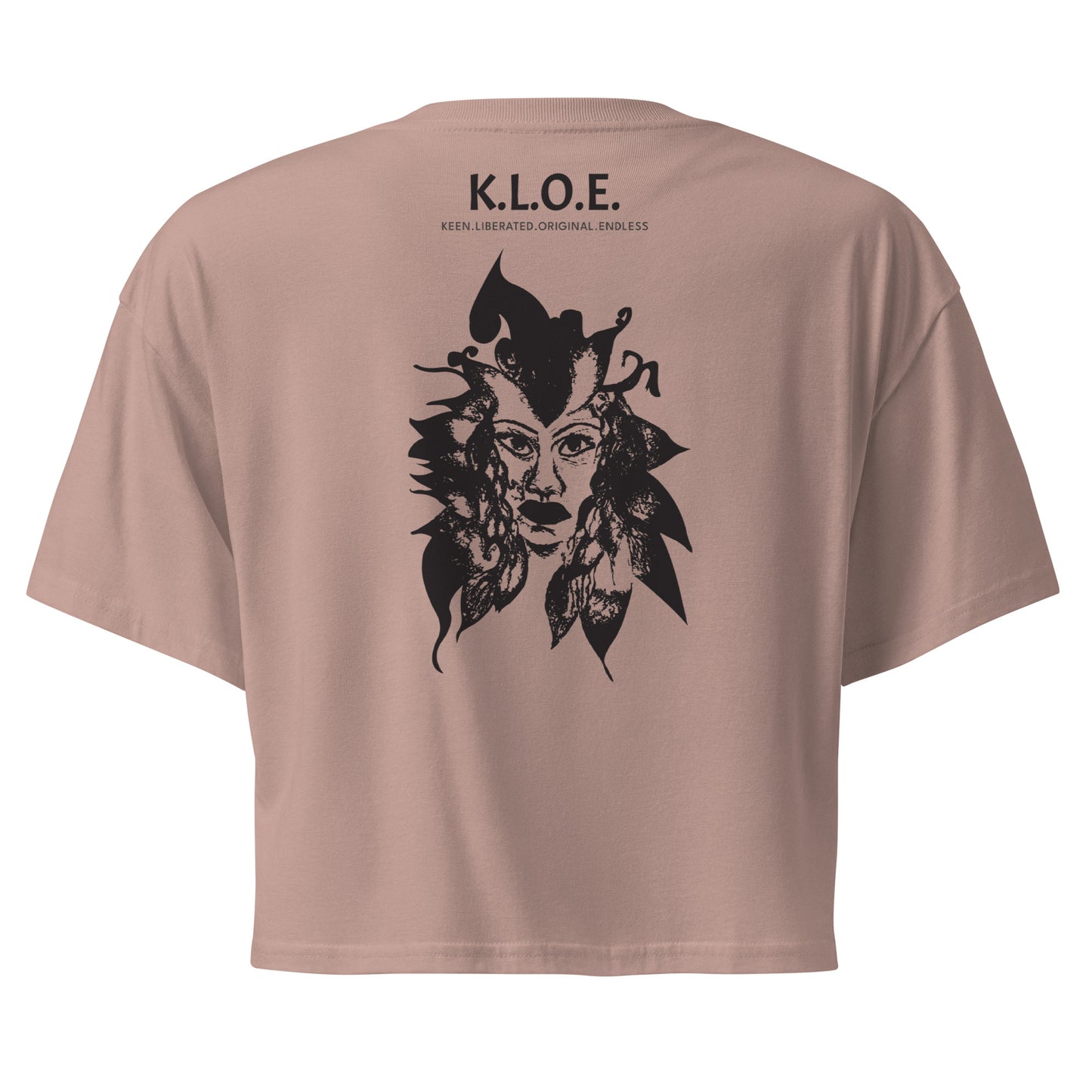 Back view of a hazy pink K.L.O.E. crop t-shirt showcasing a culturally inspired, hand-drawn black design featuring a bold, expressive face intertwined with flowing, abstract patterns, and K.L.O.E. logo, embodying artistic self-expression and modern bohemian style fashion.