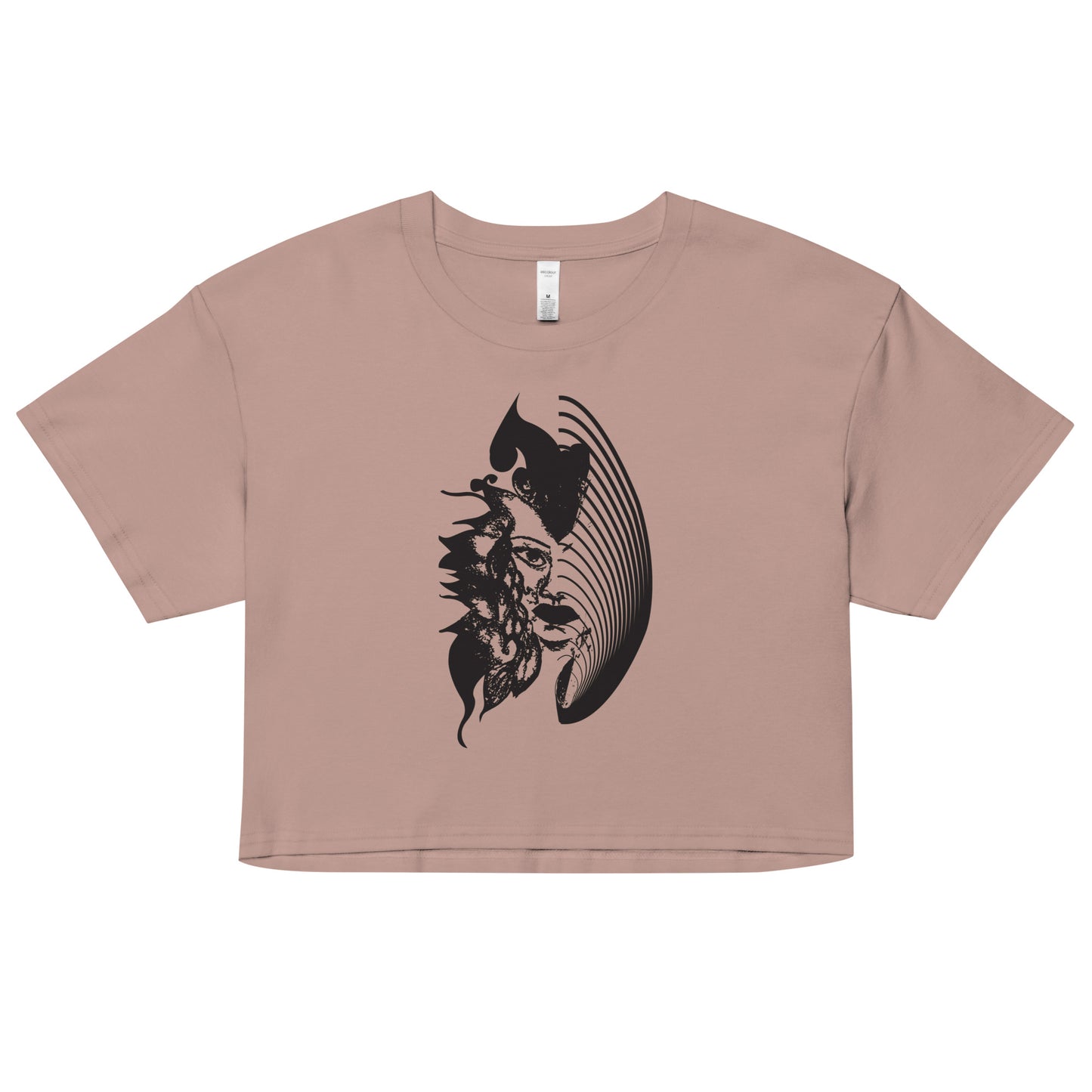 A hazy pink K.L.O.E. crop t-shirt featuring a culturally inspired, hand-drawn black graphic of a bold, expressive face surrounded by intricate details, celebrating individuality and artistic self-expression in modern bohemian style fashion.