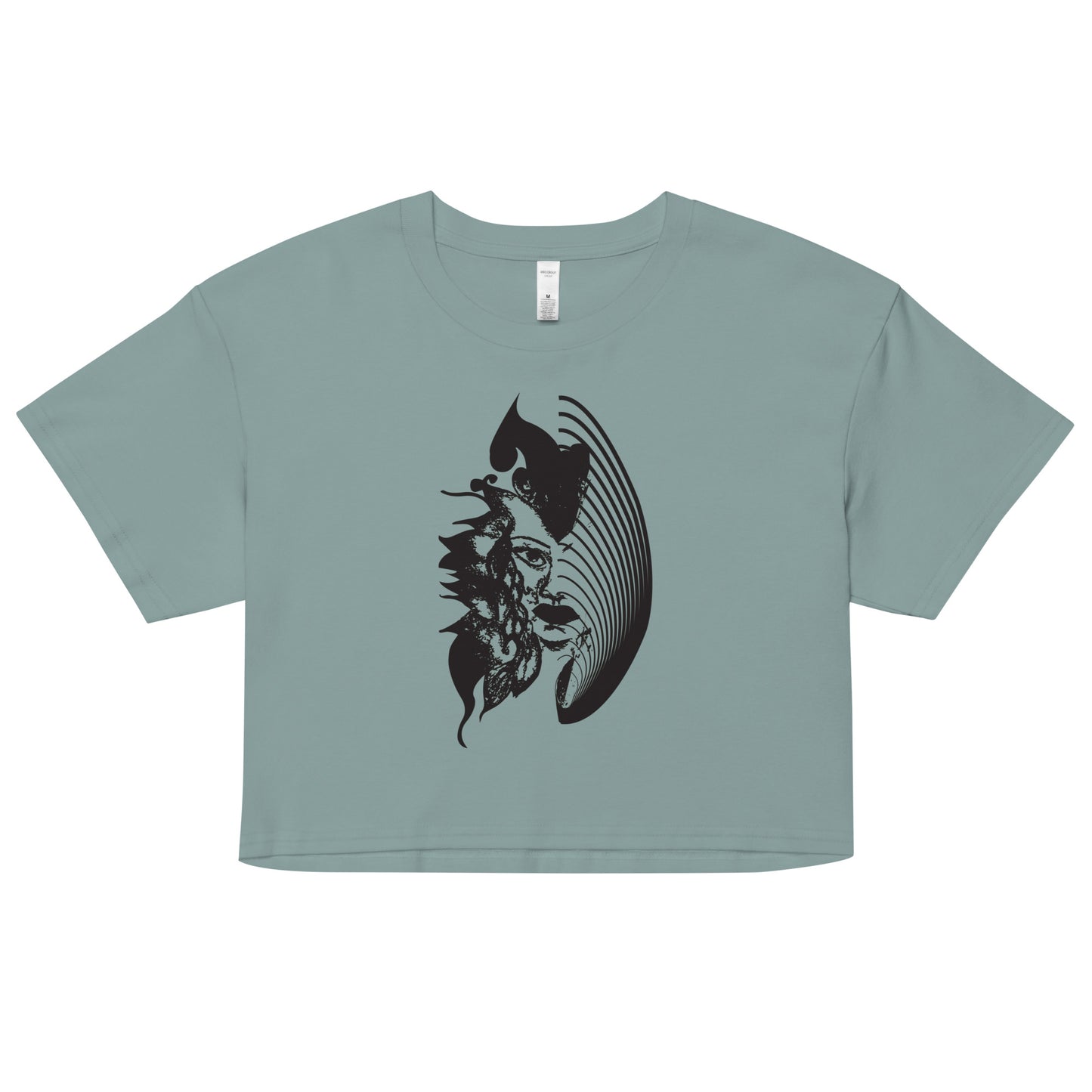 A mineral K.L.O.E. crop t-shirt featuring a culturally inspired, hand-drawn black graphic of a bold, expressive face surrounded by intricate details, celebrating individuality and artistic self-expression in modern bohemian style fashion.