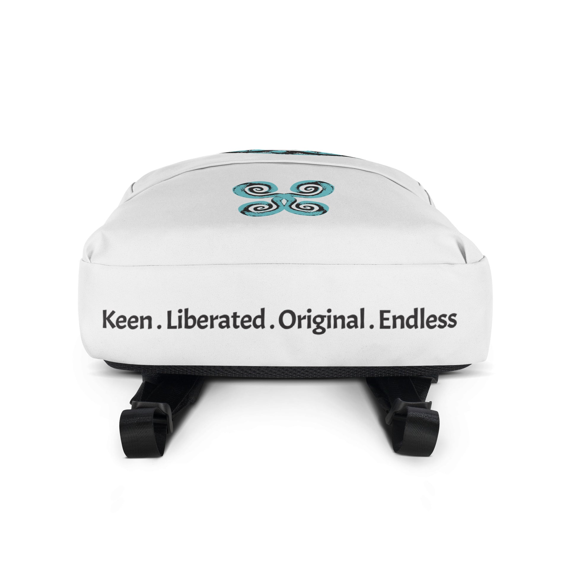 The view of the bottom panel of the white backpack, featuring a hand-drawn, culturally inspired design of two mirrored faces in bold black and teal on the main panel, and an intricate teal spiral motif on the pocket, celebrating self-expression and individuality in modern bohemian style fashion by K.L.O.E.
