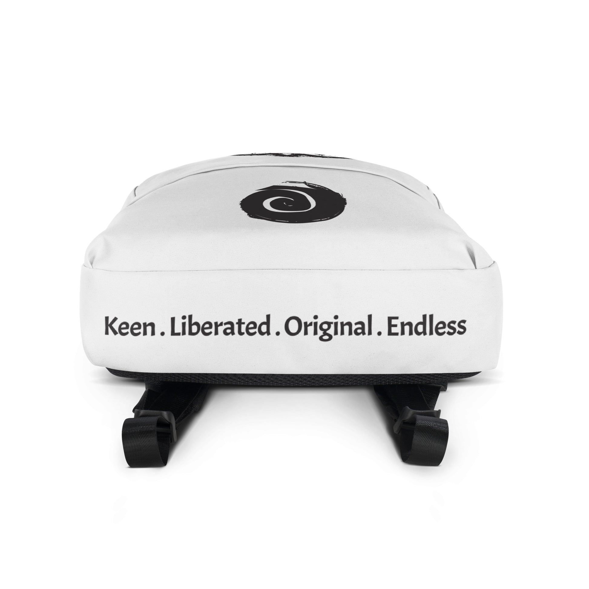 The bottom panel of the white backpack featuring a hand-drawn, culturally inspired design of two mirrored faces in bold black on the main panel, paired with a striking black spiral motif on the spacious front pocket, celebrating self-expression and individuality in modern bohemian style fashion by K.L.O.E.
