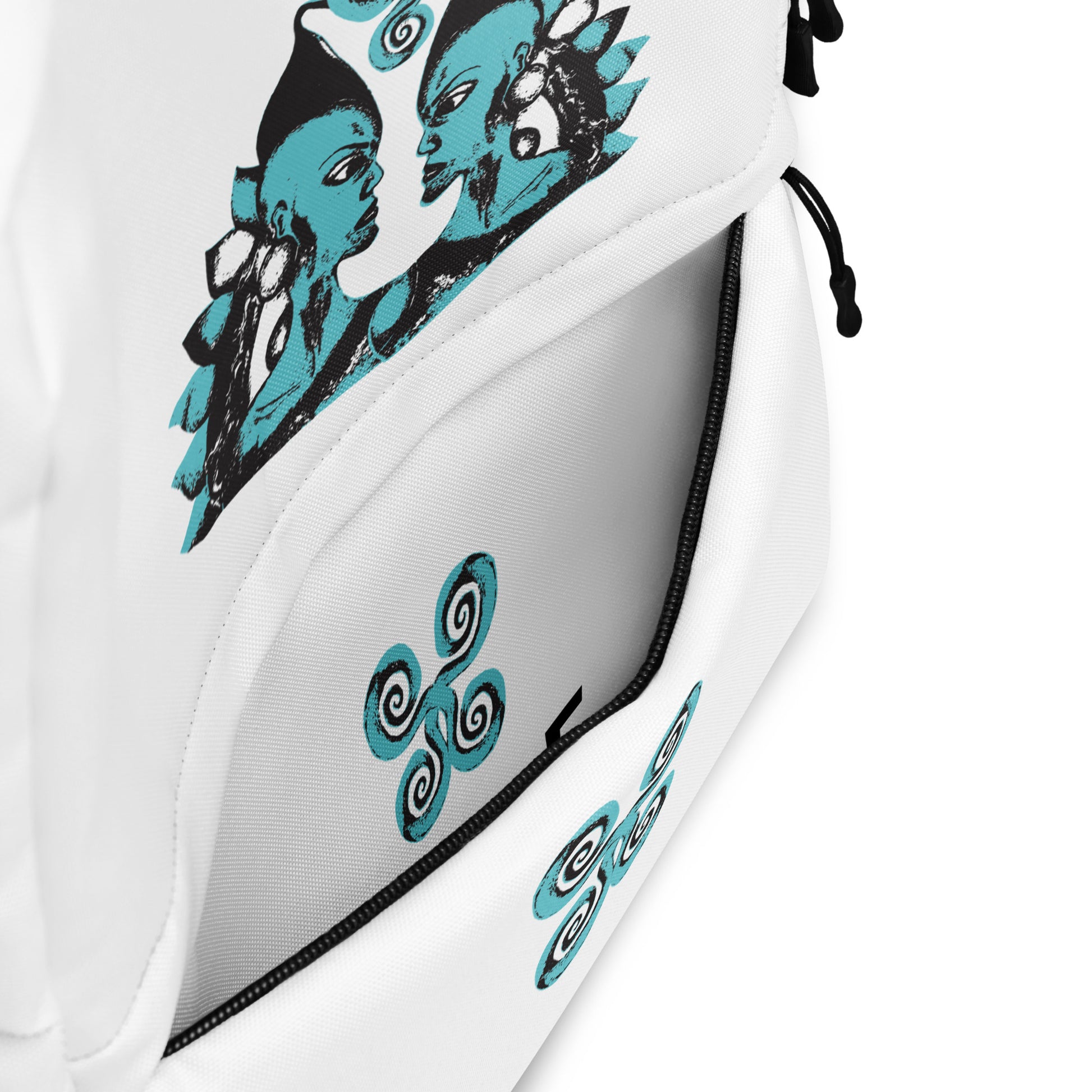 The view of the inside of the front pocket of the white backpack, featuring a hand-drawn, culturally inspired design of two mirrored faces in bold black and teal on the main panel, and an intricate teal spiral motif on the pocket, celebrating self-expression and individuality in modern bohemian style fashion by K.L.O.E.