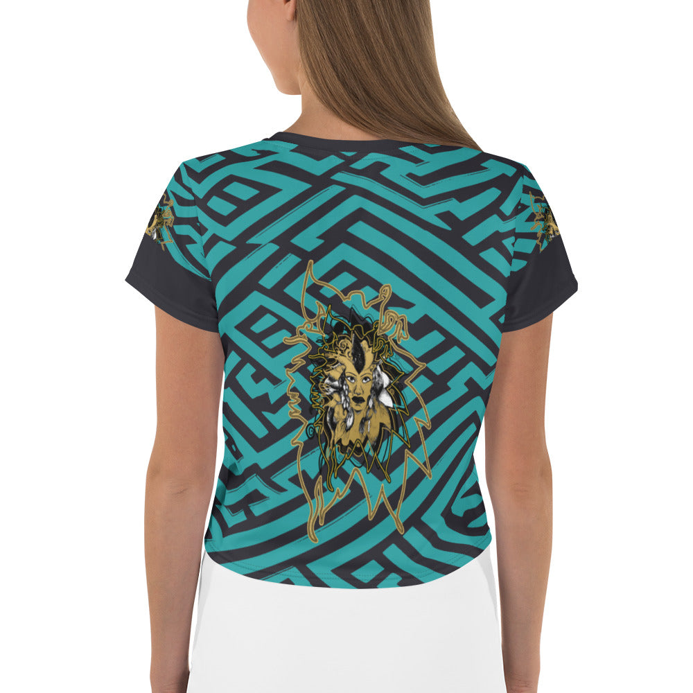 Front view of a vibrant blue and black geometric patterned crop top with a bold graphic centerpiece, perfect for streetwear fashion.